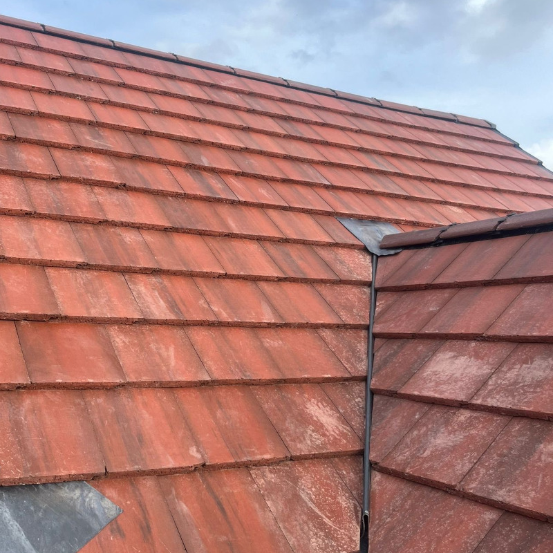 Red tiled new roof in Cheadle, Manchester.